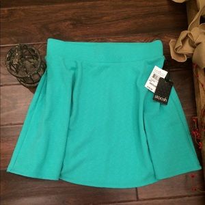Teal green textured mini skirt
